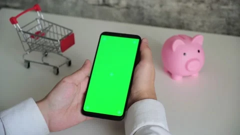 Phone with a chromakey screen in the hands of a close-up . top view smartphone Stock Footage 156728649