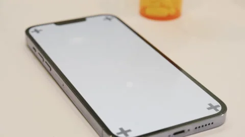 Phone On Counter With Pill Bottle In Background Stock Footage 166522590
