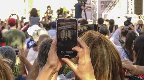 Phone in a crowd Stock Photos