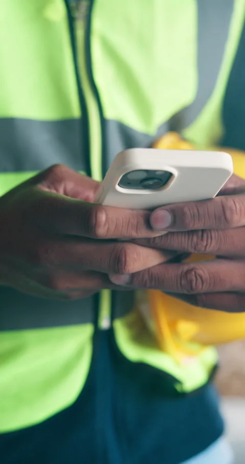 Phone, engineer and hands of man on construction site for project, renovation or Stock Footage 340964819