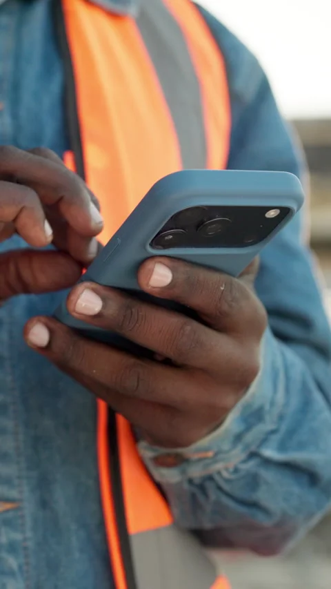 Phone, engineer and scroll with hands on construction site for architect Stock Footage 340894349