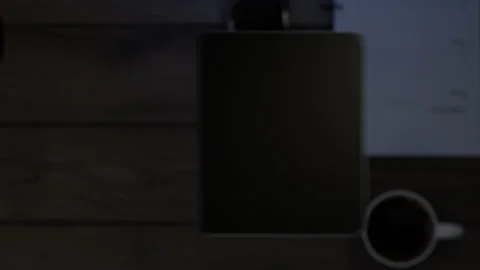 The phone falls on the table, the display turns on, which then turns into a g Stock Footage 261158115