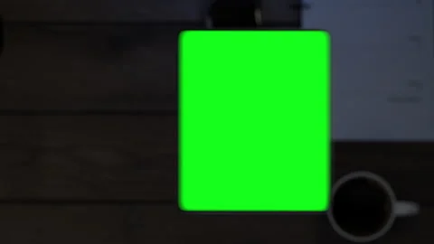 The phone falls on the table, the display turns on, which then turns into a g Stock Footage 261158123