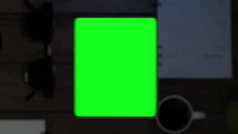 The phone falls on the table, the display turns on, which then turns into a g Stock Footage 261159336