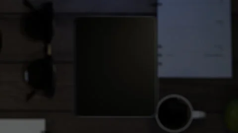 The phone falls on the table, the display turns on, which then turns into a g Stock Footage 261159352