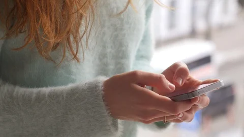 The phone in female hands. Close up Video stock 86703193