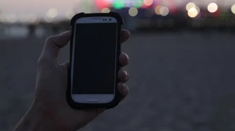 Phone in front of Ferris Wheel Video stock 41817710
