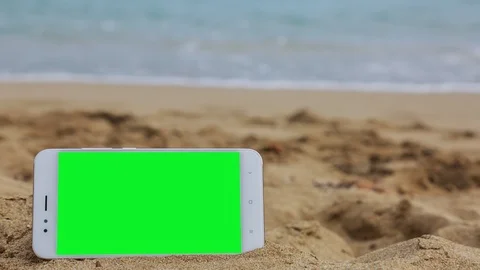 Phone with green screen on the beach 2 Stock Footage 126956296