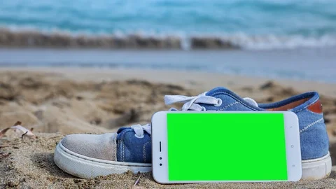 Phone with green screen on the beach 3 Stock Footage 126991103