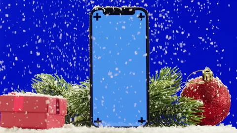Phone with green screen chroma key near Christmas new year decorations on blue Video stock 254433752