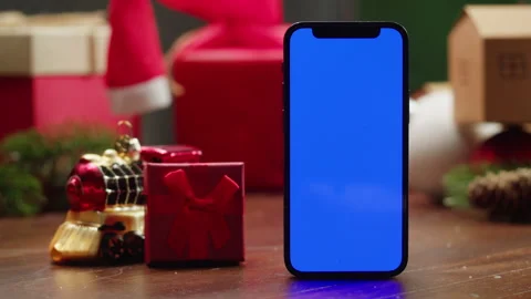 Phone with green screen chroma key near Christmas new year background, vibes of Stock Footage 255184002