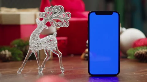 Phone with green screen chroma key near Christmas new year background, vibes of Stock Footage 255184556