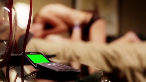Phone with Green screen in front of a cheating couple with mistress Stock-Footage 70332947