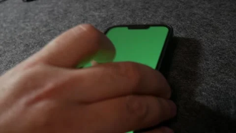 Phone with greenscreen. IPhone with greenscreen. Mobile phone with greenscreen.	 Stock Footage 255142115