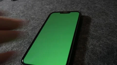 Phone with greenscreen. IPhone with greenscreen. Mobile phone with greenscreen. Stock Footage 255142132