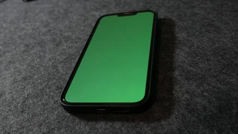 Phone with greenscreen. IPhone with greenscreen. Mobile phone with greenscreen.	 Stock Footage 255142141
