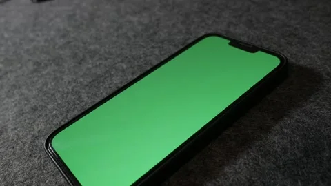 Phone with greenscreen. IPhone with greenscreen. Mobile phone with greenscreen. Stock Footage 255142148