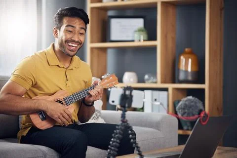 Phone, guitar tutorial and man with a smile online to coach during live Stock Photos
