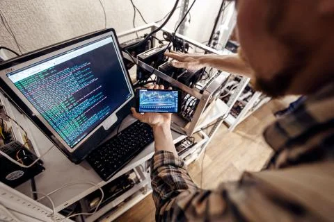 Phone in hand on computer background Stock-Fotos