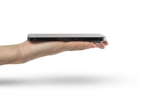 Phone in hand isolate on white background. A modern smartphone lies on the palm Stock Photos