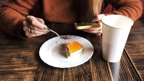 Phone in hands, coffee, cake during lunch Stock Footage 116747450
