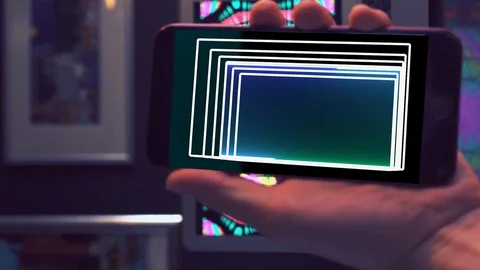 A phone in his hand close-up with the addition of VFX Stock Footage 129514526