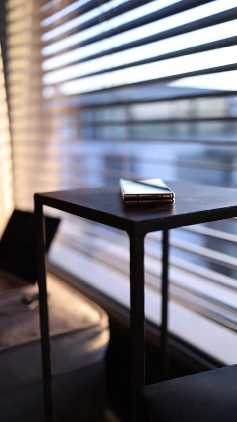 Phone lies on table vertical video Stock Footage 289218999