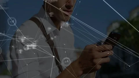 Phone lighting causing man checking phone, camera zooming hands as data overlay Stock Footage 332577347