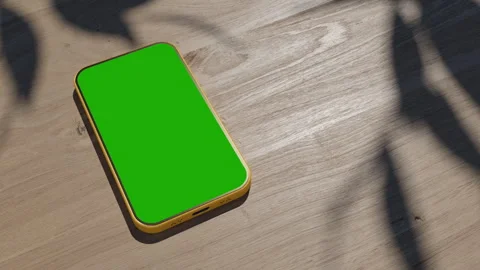 A phone lying on a table, an animation of a gadget on a wooden table. the vid Stock Footage 260939261