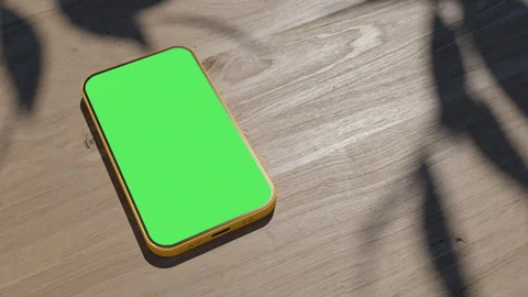 A phone lying on a table, an animation of a gadget on a wooden table. the vid Stock Footage 260939651