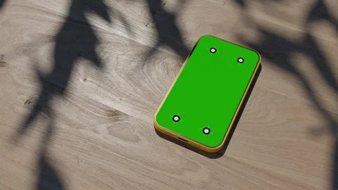 A phone lying on a table, an animation of a gadget on a wooden table. The vid Stock-Footage 260939696