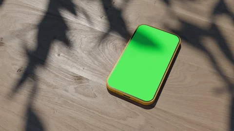 A phone lying on a table, an animation of a gadget on a wooden table. The vid Stock Footage 260939799