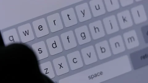 Phone macro screen, on-screen keyboard, women's fingers type text, close-up Stock Footage 221641362