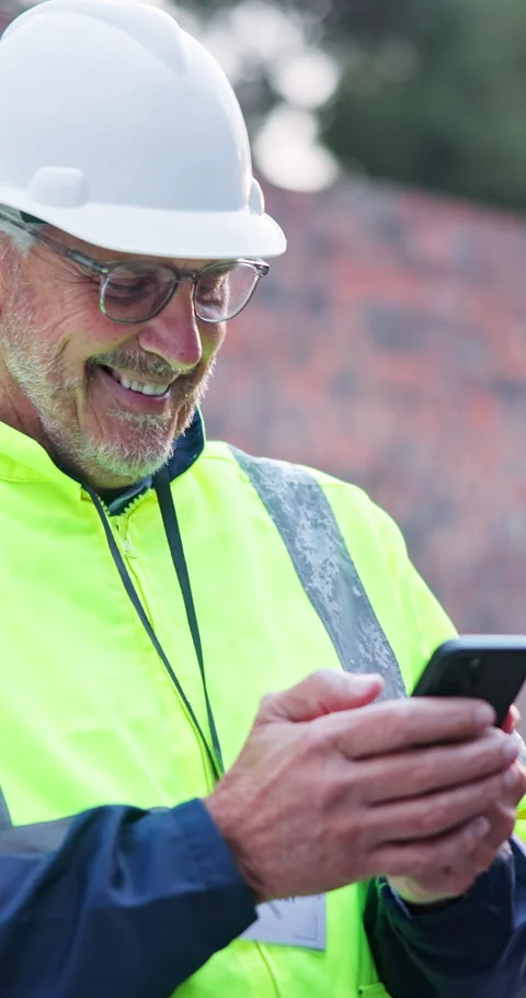 Phone, man and construction worker on site for feedback on maintenance, building Stock Footage 340951119
