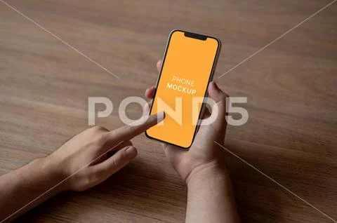 Phone in Mans Hand Mockup PSD Template
