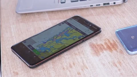 Phone with navigation map and laptop Stock Footage 169255011