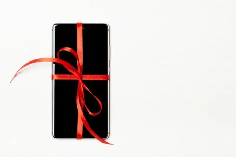 Phone packaged as a gift Stock Photos