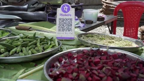 Phone Pe UPI QR code scanner at street vegetable seller Stock Footage 304491370