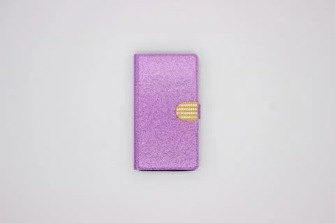 Phone in pink case on gray background Stock Photos