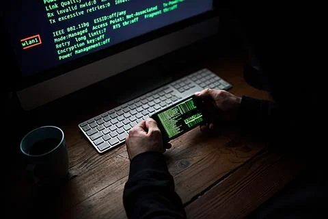 Phone, programmer hands and code screen with software for hacking crime or cyber Stock Photos