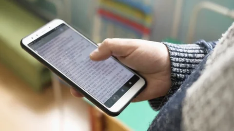 Phone read book.smart Stock Footage 124609249