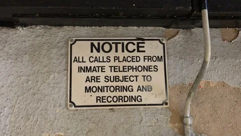 Phone recording sign placed in prison Stock Footage