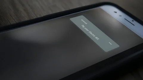 A Phone Reminder Notification on Generic Device to Pay a Electric Bill Stock Footage 124746543