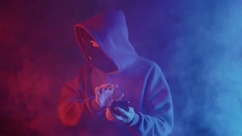 Phone scammer in a mask Stock Footage 201603635