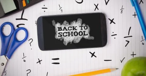 Phone on a school table with back to school text on screen Foto stock