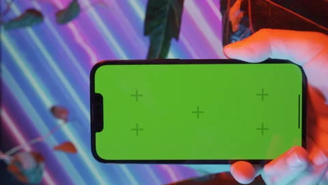 Phone screen concept vertical video hand holding phone with green screen Stock Footage 221237134