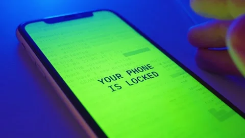 Phone screen notification of virus or ransomware on a controlled hacked device Stock Footage 323842244