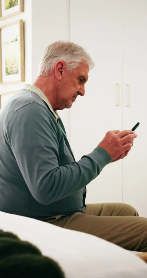 Phone, scroll and old man in retirement home with smile, social media and good Stock Footage 338222322