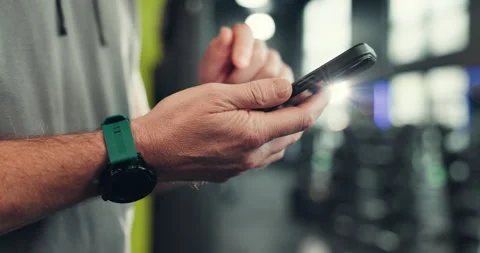 Phone, search and hands of man at gym for fitness app, workout schedule and Stock-Footage 314148502