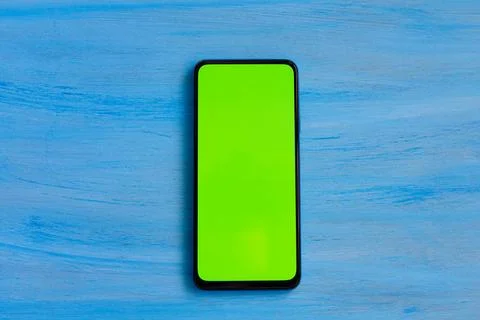 Phone smartphone, green screen on Blue wood background top view Stock Illustration